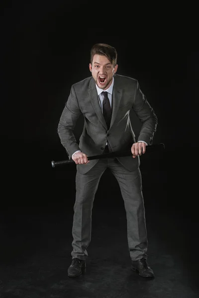 Angry businessman with bat — Stock Photo, Image