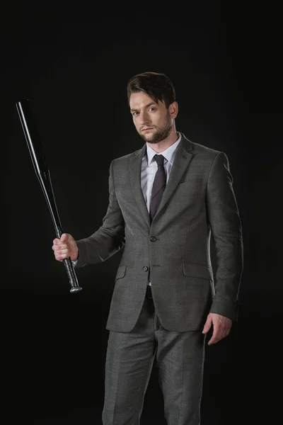 Serious businessman with bat — Stock Photo, Image