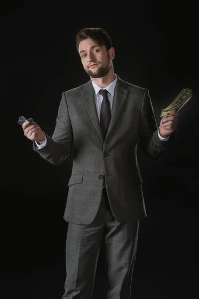 Businessman holding money — Free Stock Photo