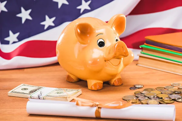 Diploma and piggy bank — Stock Photo