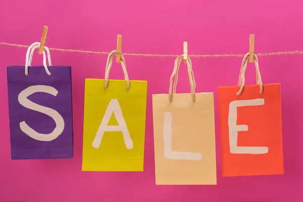 Sale signs on shopping bags — Stock Photo