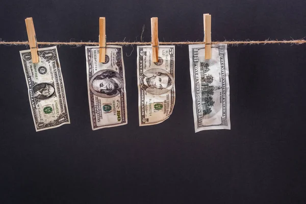 Dollar banknotes hanging on rope — Stock Photo