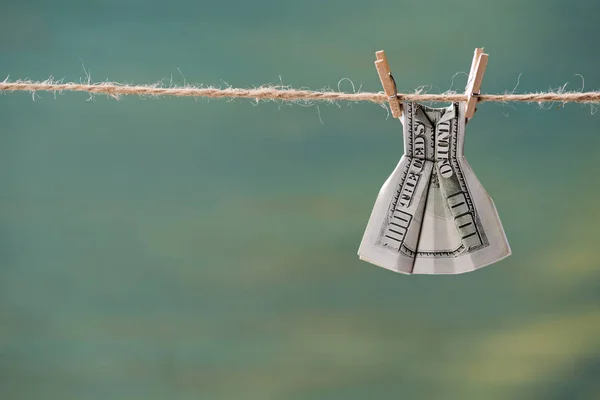 Dollar banknote on clothesline — Stock Photo