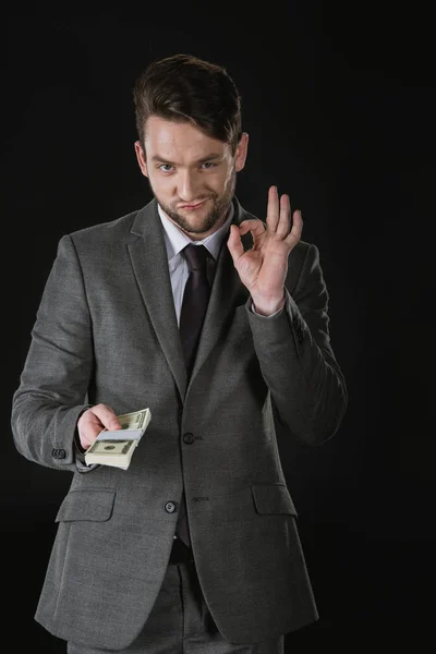 Homme d'affaires avec billets en dollars — Photo de stock