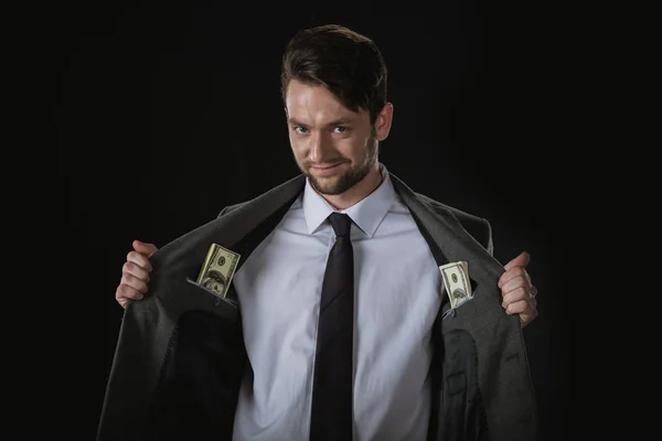 Бизнесмен с долларовыми банкнотами — стоковое фото