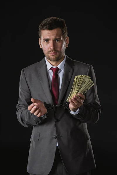 Businessman holding money — Stock Photo