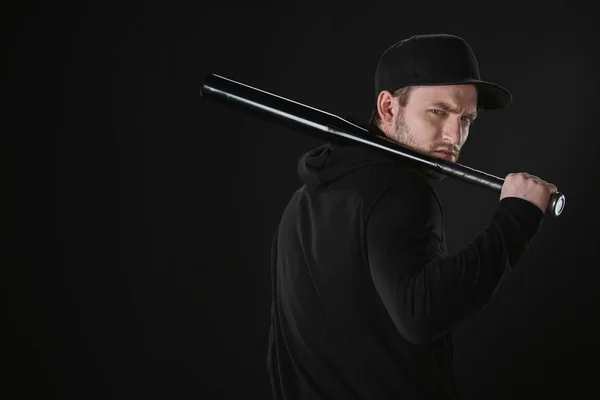 Young robber in zoodie with baseball bat — Stock Photo
