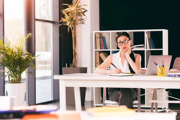 Businesswoman working in office — Stock Photo