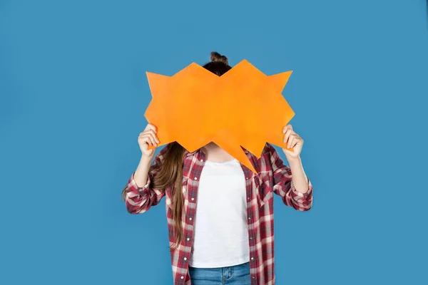 Girl covering face with speech bubble — Stock Photo