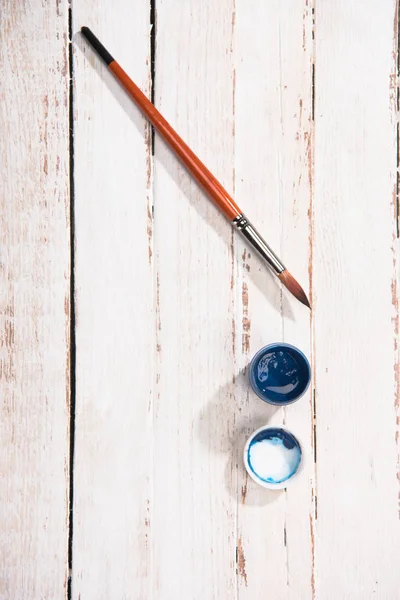 Paint container and brush — Stock Photo, Image