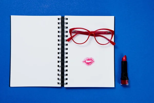 Pair of glasses on notebook — Stock Photo, Image