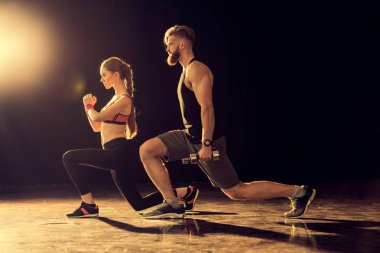Sporty man and woman training 
