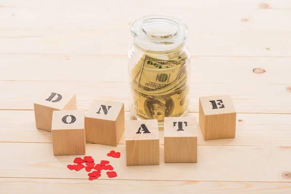 Dollar banknotes in glass jar — Stock Photo, Image