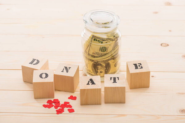 Dollar banknotes in glass jar 