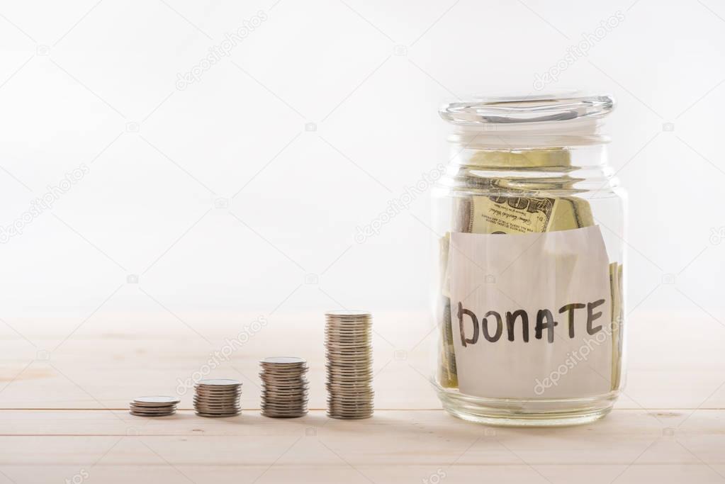 Dollar banknotes in glass jar 