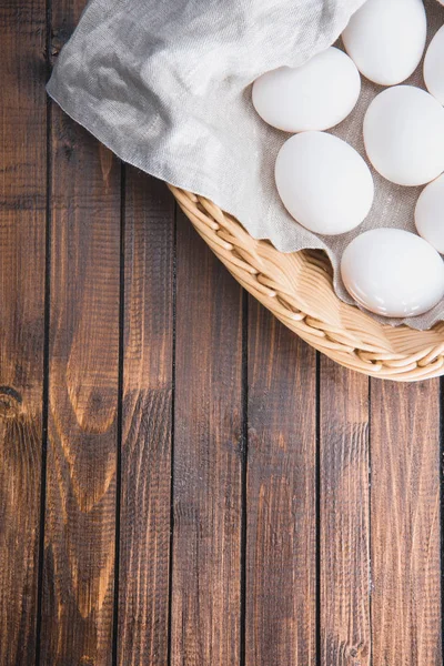 Chicken eggs in basket — Stock Photo