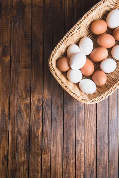 Chicken eggs in basket — Stock Photo