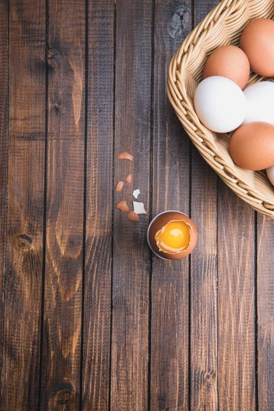 Chicken eggs in basket — Stock Photo