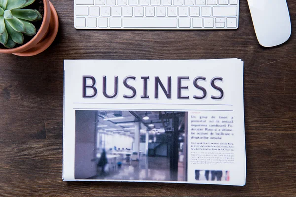 Newspaper on office desk — Stock Photo