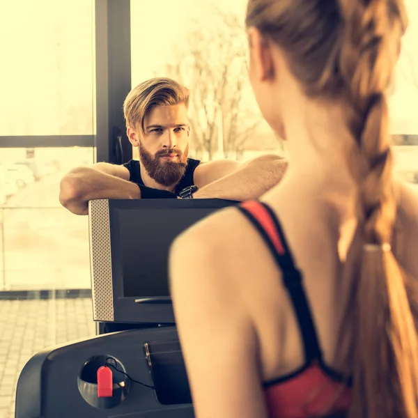 Sportspeople training with treadmill — Stock Photo