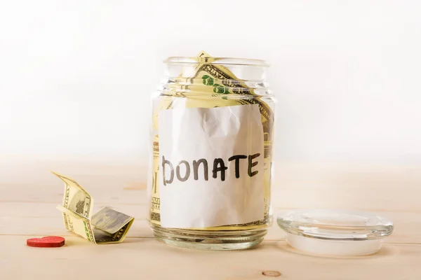 Dollar banknotes in glass jar — Stock Photo