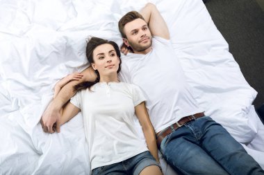 couple lying in bed clipart