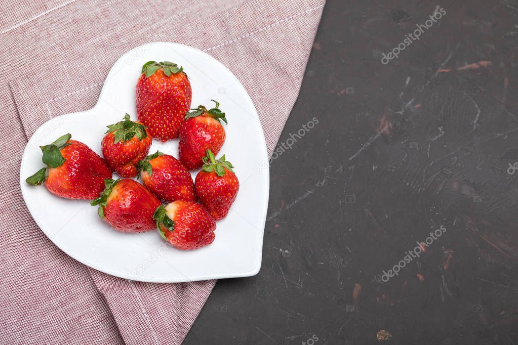 strawberries on heart shaped plate