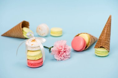 Macarons with flower and waffle cones clipart