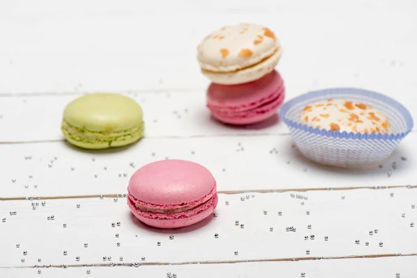 Group of macarons on wooden table — Stock Photo, Image