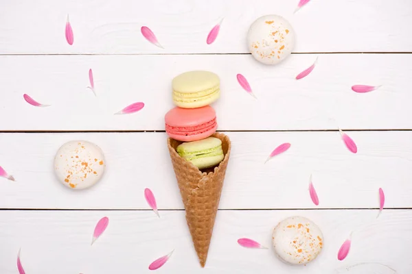 Handmade fresh macarons in waffle cone — Stock Photo, Image