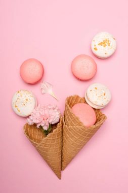 Fresh macarons in waffle cones clipart