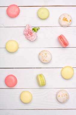 Variety of fresh macaroons in waffle cones clipart