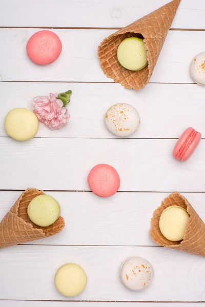 Variety of fresh macaroons in waffle cones — Stock Photo, Image