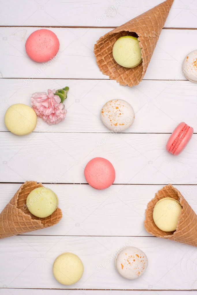 Variety of fresh macaroons in waffle cones