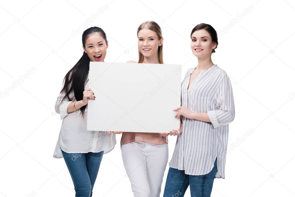 smiling girls holding blank banner