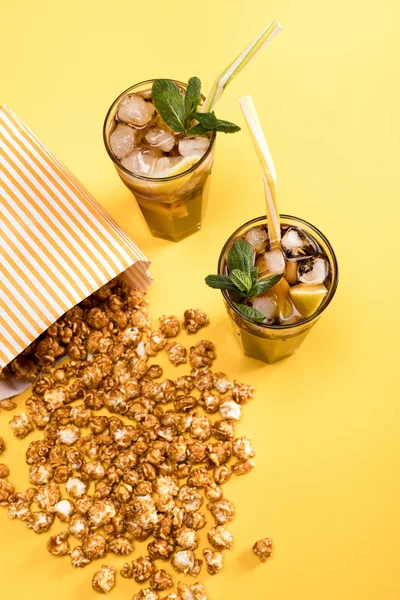 Popcorn and drinks in glasses — Stock Photo