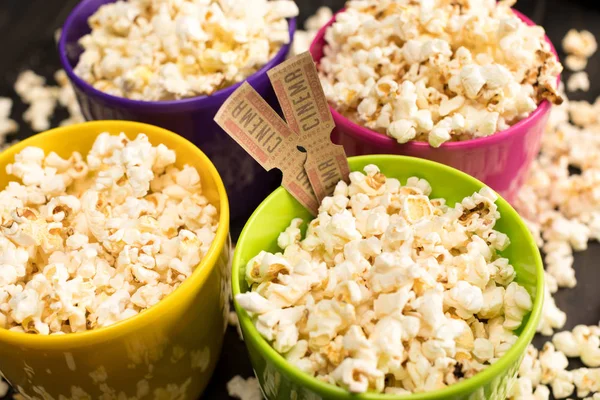 Popcorn and movie tickets — Stock Photo