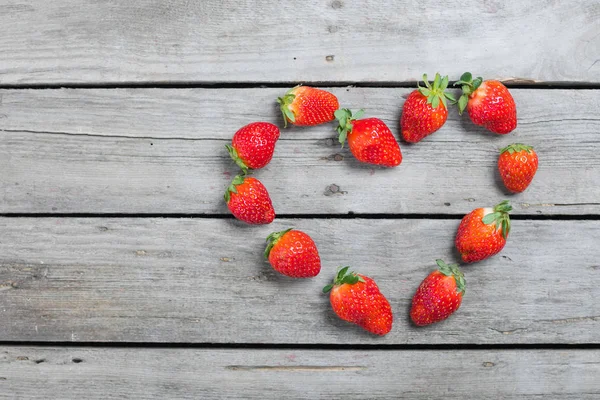 Strawberries in heart shape — Stock Photo