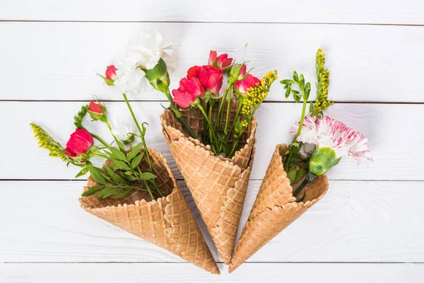 Flowers in waffle cones — Stock Photo