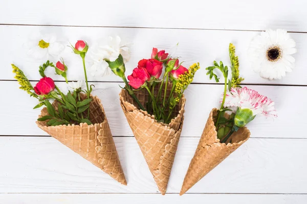 Flowers in waffle cones — Stock Photo