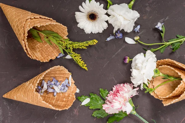 Flowers in waffle cones — Stock Photo