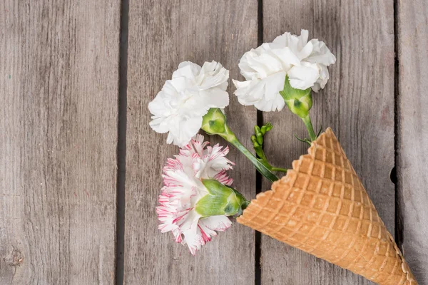 Flowers in waffle cone — Stock Photo