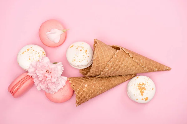 Pink and white macarons in waffle cones — Stock Photo