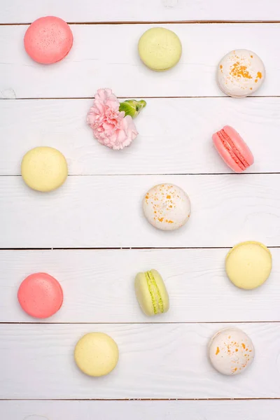 Variety of fresh macaroons in waffle cones — Stock Photo