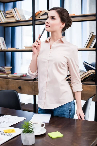 Young businesswoman at workplace — Stock Photo