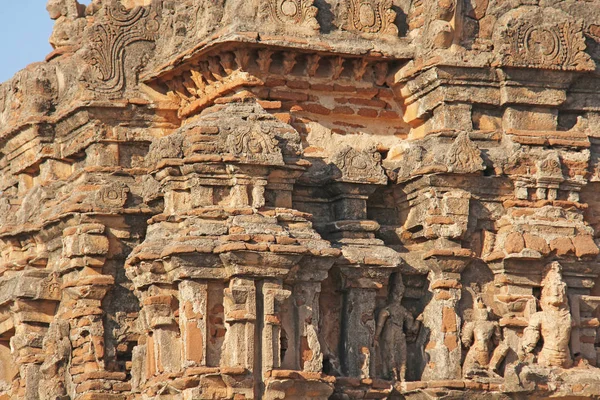 Hazara Rama Temple in Hampi, Karnataka, India. Unesco World Heritage Site. Carving stone ancient background. Fragment of red brick terracotta. Beige ancient antique background. — Stock Photo, Image