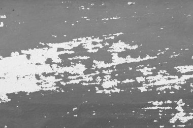 Eski lapa lapa boya soyulmuştu bir Grungy kırık duvar. Çatlaklar, eski soyulması boya ve eski çimento duvar arka plan üzerinde sıva. Beyaz ve gri noktalar boya. Bir çimento taş duvar eski Vintage kırık olarak.