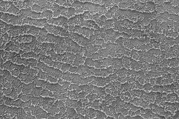 Barren earth. Dry cracked earth background. Cracked mud grey pattern. Soil In cracks.Creviced texture.Drought land. Environment drought.