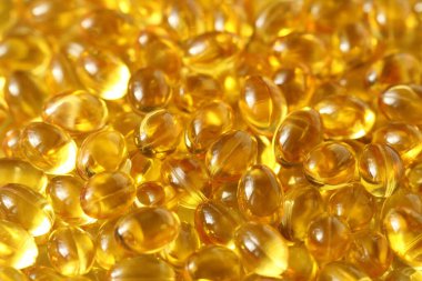 Altın arka plan kapsülleri gıda takviyesi kapsüllerini kapatın A vitamini, D3 vitamini, balık yağı, Omega 3, 6, 9, akşam çuha çiçeği yağı, keten tohumu yağı, D vitamini, E vitamini.