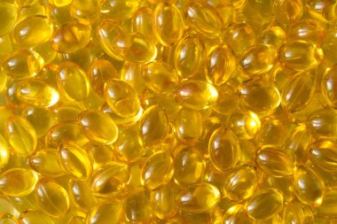 Altın arka plan kapsülleri gıda takviyesi kapsüllerini kapatın A vitamini, D3 vitamini, balık yağı, Omega 3, 6, 9, akşam çuha çiçeği yağı, keten tohumu yağı, D vitamini, E vitamini.